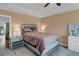 Serene main bedroom features plush bedding, ambient lighting, and stylish decor for a peaceful retreat at 2820 Aralynn Way, Atlanta, GA 30337