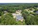 Aerial view of a home nestled among trees in a serene neighborhood at 4759 Highland Point Dr, Auburn, GA 30011
