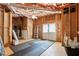 Unfinished basement with exposed beams, cement floor, and a pair of white exterior doors at 4759 Highland Point Dr, Auburn, GA 30011