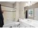 Well-lit bathroom with a shower-tub combo and a single sink vanity at 4759 Highland Point Dr, Auburn, GA 30011