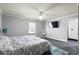 Bedroom with a ceiling fan, gray walls, and a turquoise-colored shag rug at 4759 Highland Point Dr, Auburn, GA 30011