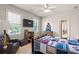 Bedroom with ceiling fan, two windows, and sports themed decor at 4759 Highland Point Dr, Auburn, GA 30011