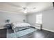 Comfortable bedroom with a ceiling fan, gray walls, and a turquoise-colored shag rug at 4759 Highland Point Dr, Auburn, GA 30011