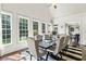 Bright dining area featuring many windows and a large table perfect for gatherings, enhanced by natural light and an open layout at 4759 Highland Point Dr, Auburn, GA 30011