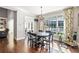 Bright dining area featuring a chandelier and natural light from large windows at 4759 Highland Point Dr, Auburn, GA 30011