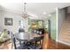 Dining room next to kitchen area with modern light fixture at 4759 Highland Point Dr, Auburn, GA 30011