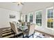 Light-filled dining room featuring shiplap walls, a farmhouse table, and ample natural light, perfect for Gathering gatherings at 4759 Highland Point Dr, Auburn, GA 30011