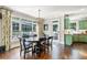 Sunlit dining area with large windows and chandelier lighting at 4759 Highland Point Dr, Auburn, GA 30011