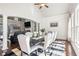Elegant dining room featuring shiplap walls, ample natural light, and seating for eight, creating a welcoming atmosphere at 4759 Highland Point Dr, Auburn, GA 30011