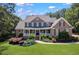 Charming brick home with a welcoming front porch and well-manicured landscaping at 4759 Highland Point Dr, Auburn, GA 30011