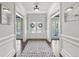 Elegant foyer with hardwood floors, decorative rug, and grand entrance at 4759 Highland Point Dr, Auburn, GA 30011