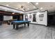 Finished game room boasts a pool table and a projector screen for the ultimate entertainment at 4759 Highland Point Dr, Auburn, GA 30011
