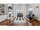 Open living room featuring high ceilings, fireplace with built-ins, and access to dining area, perfect for modern living at 4759 Highland Point Dr, Auburn, GA 30011