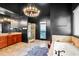 Beautiful bathroom featuring a soaking tub, tiled shower, double vanity and dark modern walls at 4759 Highland Point Dr, Auburn, GA 30011