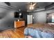 Stunning main bedroom featuring dark walls, hardwood floors, and an access to a luxurious bathroom at 4759 Highland Point Dr, Auburn, GA 30011