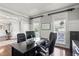 Well-lit office boasts modern desk, comfortable chair, and a bright, professional workspace ideal for focus and efficiency at 4759 Highland Point Dr, Auburn, GA 30011