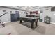 Basement area with billiards table, table tennis setup, and entertainment bar at 4771 Moon Chase Dr, Buford, GA 30519