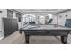 Basement with billiards table, ping pong table, and open view of a nearby living area at 4771 Moon Chase Dr, Buford, GA 30519