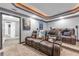 Finished basement with comfortable seating and a large screen for watching movies at 4771 Moon Chase Dr, Buford, GA 30519