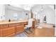 Bright bathroom boasts double vanity, walk-in shower, tile flooring, and natural light at 4771 Moon Chase Dr, Buford, GA 30519