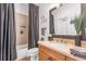 Bathroom features a vanity, a toilet, and a tiled shower/tub area at 4771 Moon Chase Dr, Buford, GA 30519