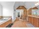 Bathroom featuring a soaking tub, glass enclosed shower and an arched ceiling at 4771 Moon Chase Dr, Buford, GA 30519