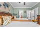Well-lit bedroom offering an ensuite bathroom and scenic natural light at 4771 Moon Chase Dr, Buford, GA 30519