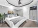 Modern bedroom with gray walls, large bed, and plenty of natural light at 4771 Moon Chase Dr, Buford, GA 30519