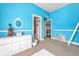 Bright bedroom featuring blue walls, carpet floors and white accents at 4771 Moon Chase Dr, Buford, GA 30519