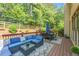 Outdoor deck space with comfortable lounge seating and outdoor dining area at 4771 Moon Chase Dr, Buford, GA 30519