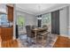 Dining area featuring natural light from a door to the outdoor deck at 4771 Moon Chase Dr, Buford, GA 30519