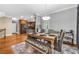 Open concept dining area leading to the kitchen featuring hardwood floors at 4771 Moon Chase Dr, Buford, GA 30519