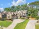 Stately two-story home featuring manicured lawns, mature trees and a convenient circular driveway at 4771 Moon Chase Dr, Buford, GA 30519