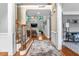 Bright foyer with hardwood floors, staircase and view into the living room at 4771 Moon Chase Dr, Buford, GA 30519