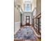Grand foyer with hardwood flooring and staircase, leading to a bright and inviting home at 4771 Moon Chase Dr, Buford, GA 30519