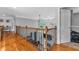Hallway overlooking the living room with hardwood floors and metal railings at 4771 Moon Chase Dr, Buford, GA 30519