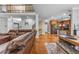 Open-concept living space showcasing the kitchen and dining area, complemented by a comfortable sofa at 4771 Moon Chase Dr, Buford, GA 30519
