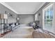 Cozy living room featuring gray walls, natural light and ample seating at 4771 Moon Chase Dr, Buford, GA 30519