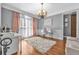 Elegant office with chandelier, hardwood floors, and ample workspace at 4771 Moon Chase Dr, Buford, GA 30519