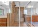 A tile shower featuring tiled walls, a shower head and a bench at 4771 Moon Chase Dr, Buford, GA 30519