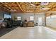 Unfinished basement with natural light, exercise equipment, and garage door at 533 Coolsprings Walk, Woodstock, GA 30188