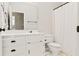 Bathroom with white cabinets, tile, and shower with a curtain at 533 Coolsprings Walk, Woodstock, GA 30188