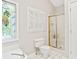 Bathroom featuring walk-in shower and stained glass window at 533 Coolsprings Walk, Woodstock, GA 30188