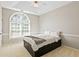Bedroom with tray ceiling, large window and carpeted floors at 533 Coolsprings Walk, Woodstock, GA 30188