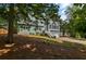 Lovely two-story home with an attached two-car garage, set back on a landscaped lot with mature trees at 533 Coolsprings Walk, Woodstock, GA 30188