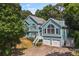 Charming two-story home boasts a two-car garage, well-maintained yard, and inviting staircase leading to the entrance at 533 Coolsprings Walk, Woodstock, GA 30188