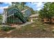 Exterior of the house showcasing a spacious backyard, deck, and screened in porch at 533 Coolsprings Walk, Woodstock, GA 30188
