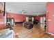 Large living room with hardwood floors and brick fireplace at 533 Coolsprings Walk, Woodstock, GA 30188