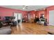 Spacious living room with hardwood floors, neutral paint, and large window at 533 Coolsprings Walk, Woodstock, GA 30188