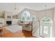 Spacious living room showcases a vaulted ceiling, large windows, a fireplace, and hardwood floors at 533 Coolsprings Walk, Woodstock, GA 30188